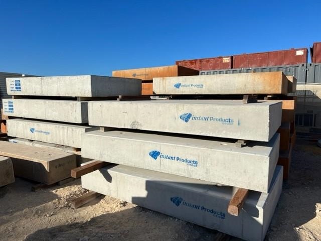 Instant Products stack of precast concrete slabs at an industrial yard