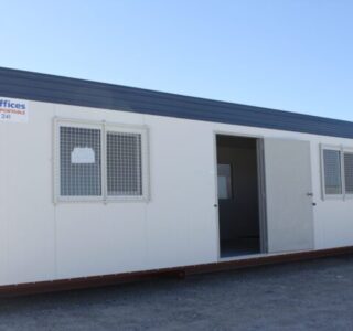 Portable modular office building with windows and open door
