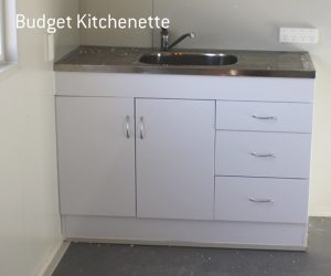 Budget kitchenette with sink, two cabinets, and three drawers.